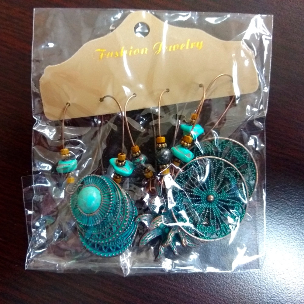 Set of three dangle earrings.